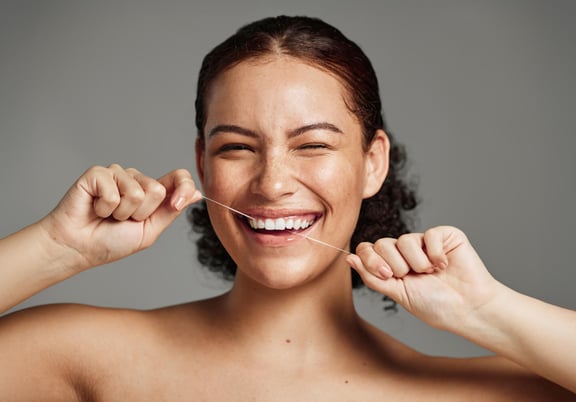 How To Floss Your Teeth: Products & Techniques